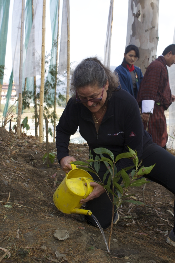 Rooted In Hope Founder, Cathy Rodgers, plants a tree seeding at Punakha High School.